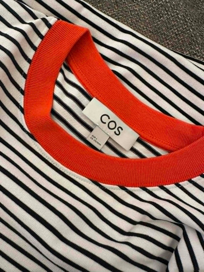 COS brand label close-up showing size EU L