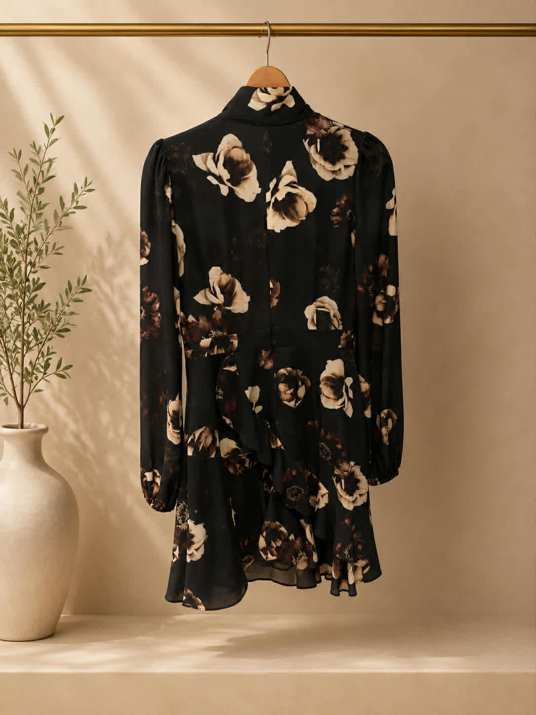 Pasduchas black floral mini dress front on hanger with pussy-bow detail