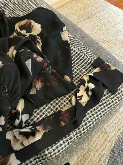 Pasduchas black floral dress laid flat detail