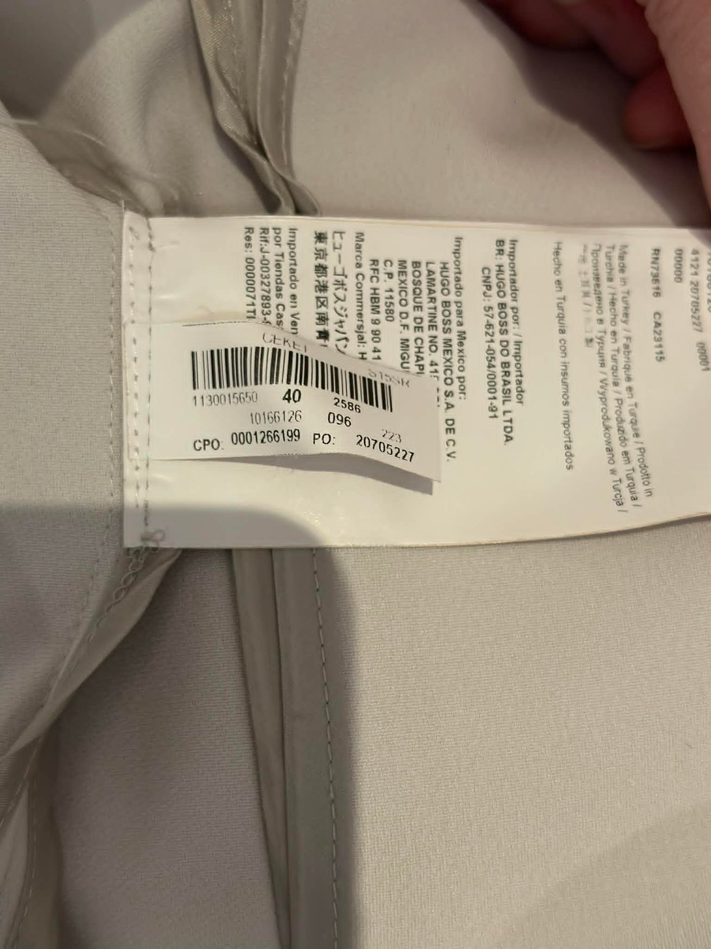 BOSS Hugo Boss care label showing size DE 40 IT 44 FR 42 UK 12