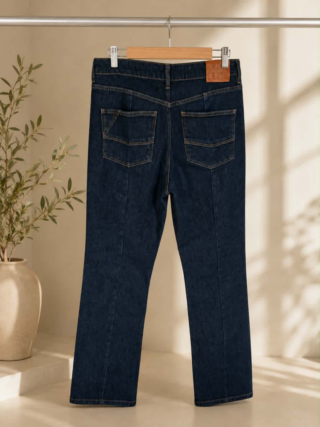Dark indigo straight-leg jeans, back view