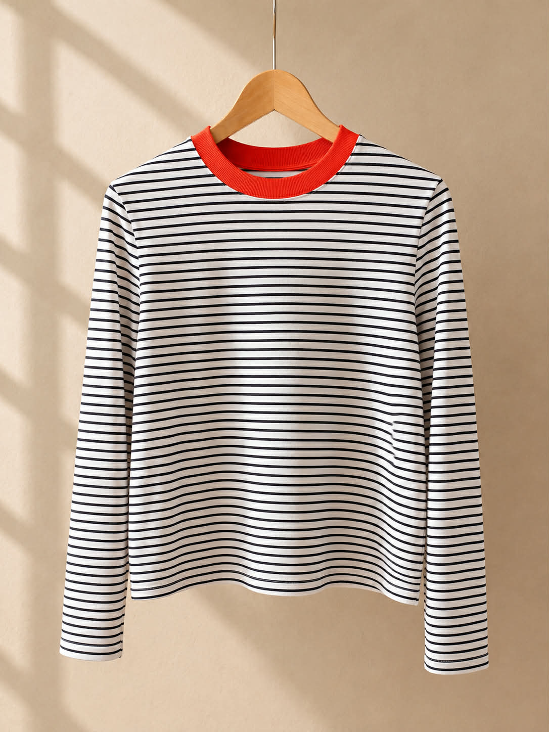 COS striped long sleeve top front view on hanger